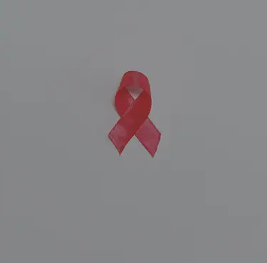 Ett rött band som symboliserar solidaritet för människor som lever med hiv och aids.